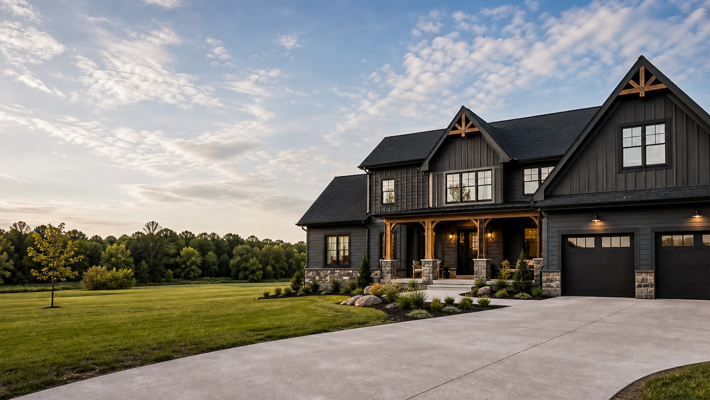 Custom Borrelli Crafters home with dark siding and warm exterior details